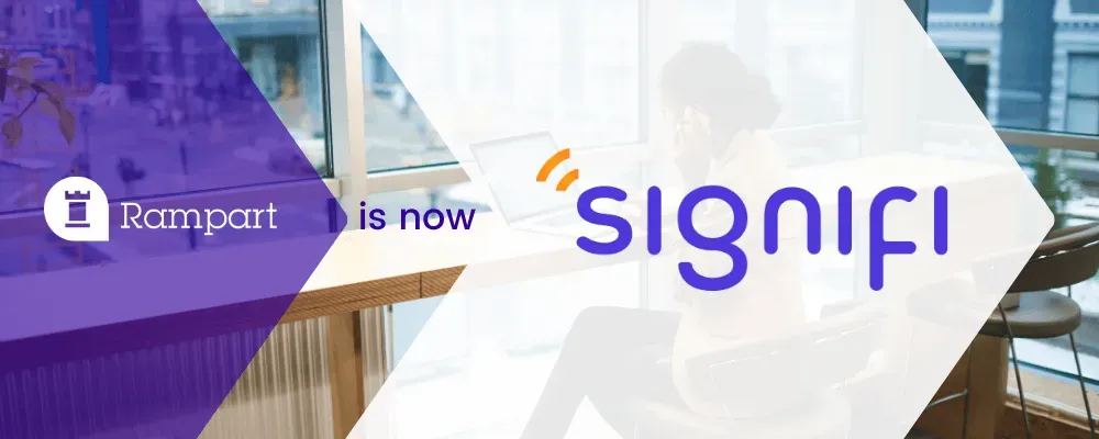 Brand transition graphic showing “Rampart” with a castle‑tower logo on the left, the words “is now” in the center, and the new name “signifi” in modern purple lettering with an orange accent, set over a blurred office background.